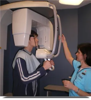 Patient having a digital panoramic dental x-ray taken